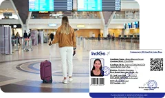 Woman with luggage at an airport terminal, holding an IndiGo boarding pass.